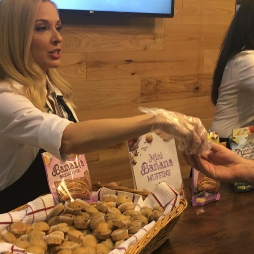 brand ambassador safely sampling FMCG food products at a tradeshow event in Los Angeles